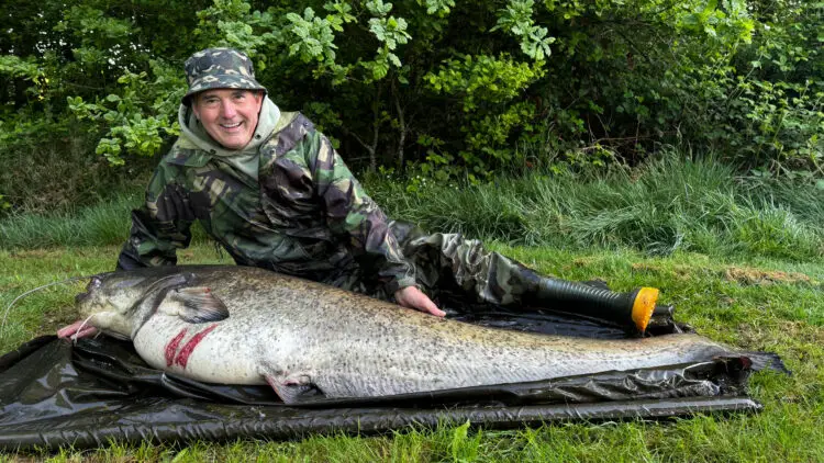 Dave with a 101lb catfish from pleasure lake, limoges